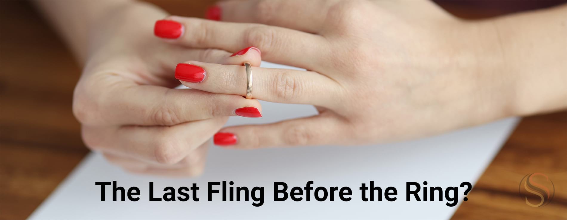 Woman putting on wedding band with the words The last fling before the ring?